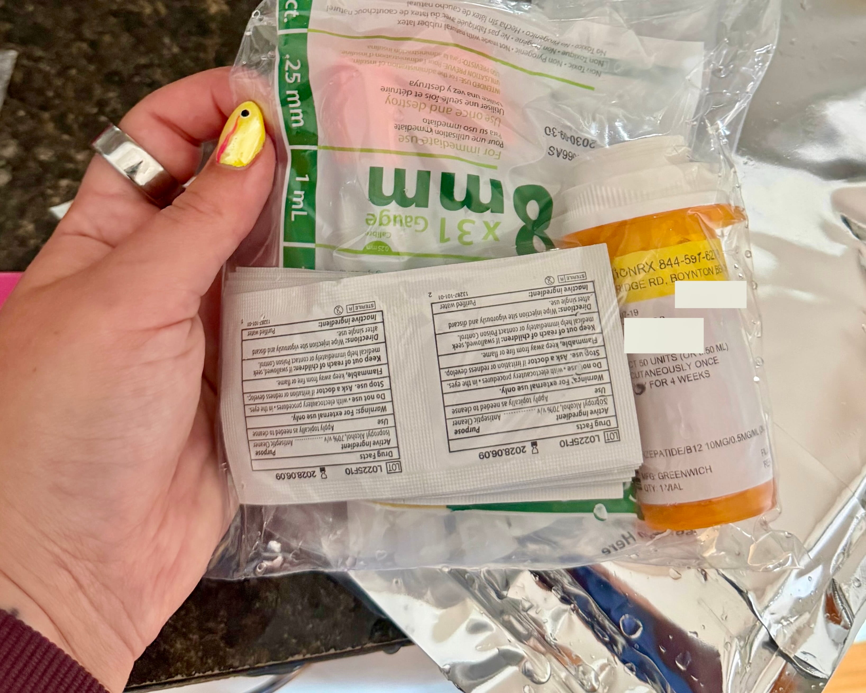 Compounded tirzepatide multi-dose vial inside the amber prescription bottle it shipped in