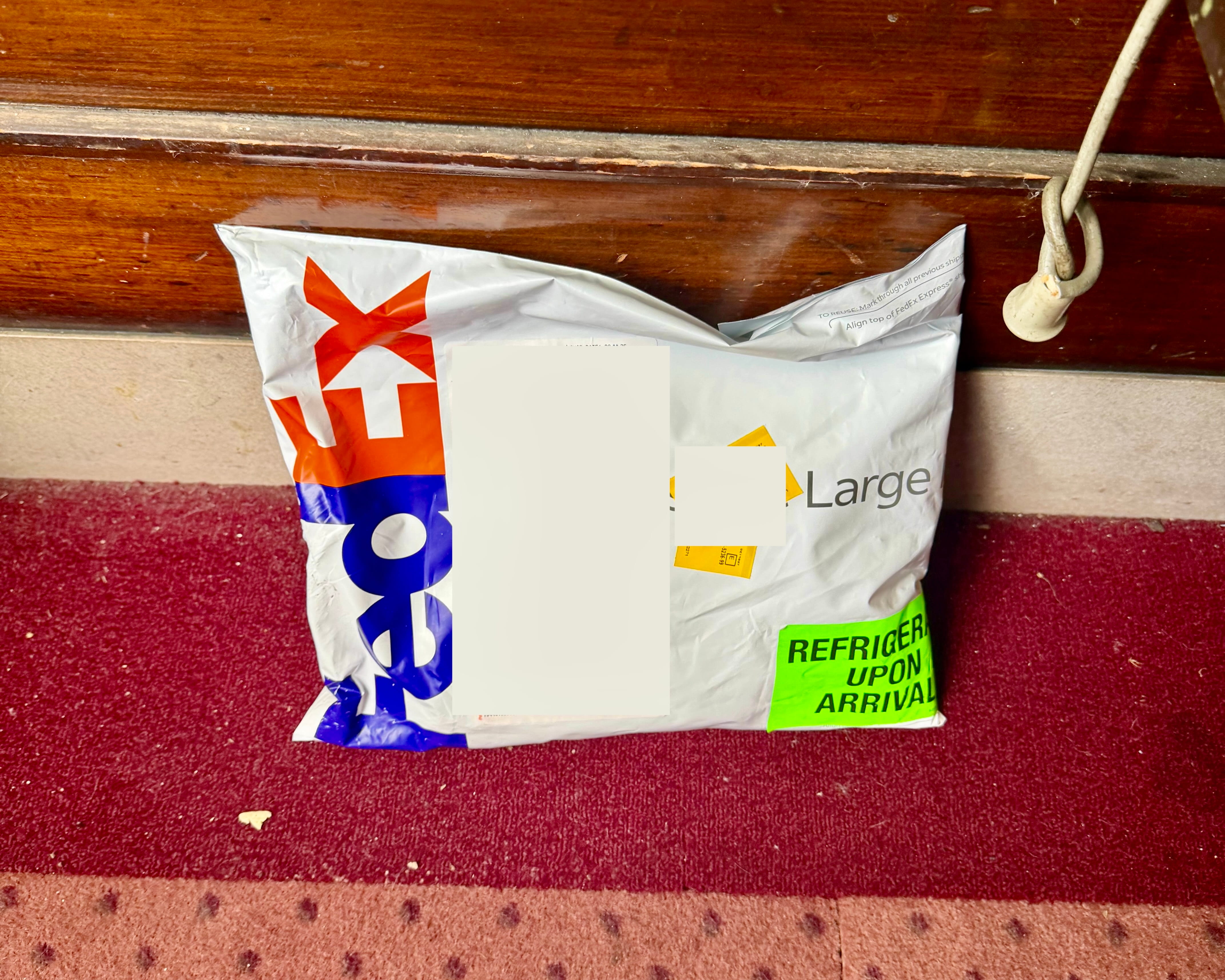 FedEx Large envelope from AltRx with a green REFRIGERATE UPON ARRIVAL sticker on the outside