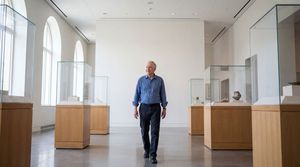 man-walking-art-gallery