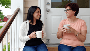 two-women-on-porch-drinking-coffee.png