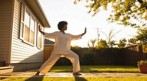 woman-doing-tai-chi-in-yard.jpg