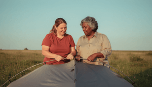 women-putting-up-tent.png