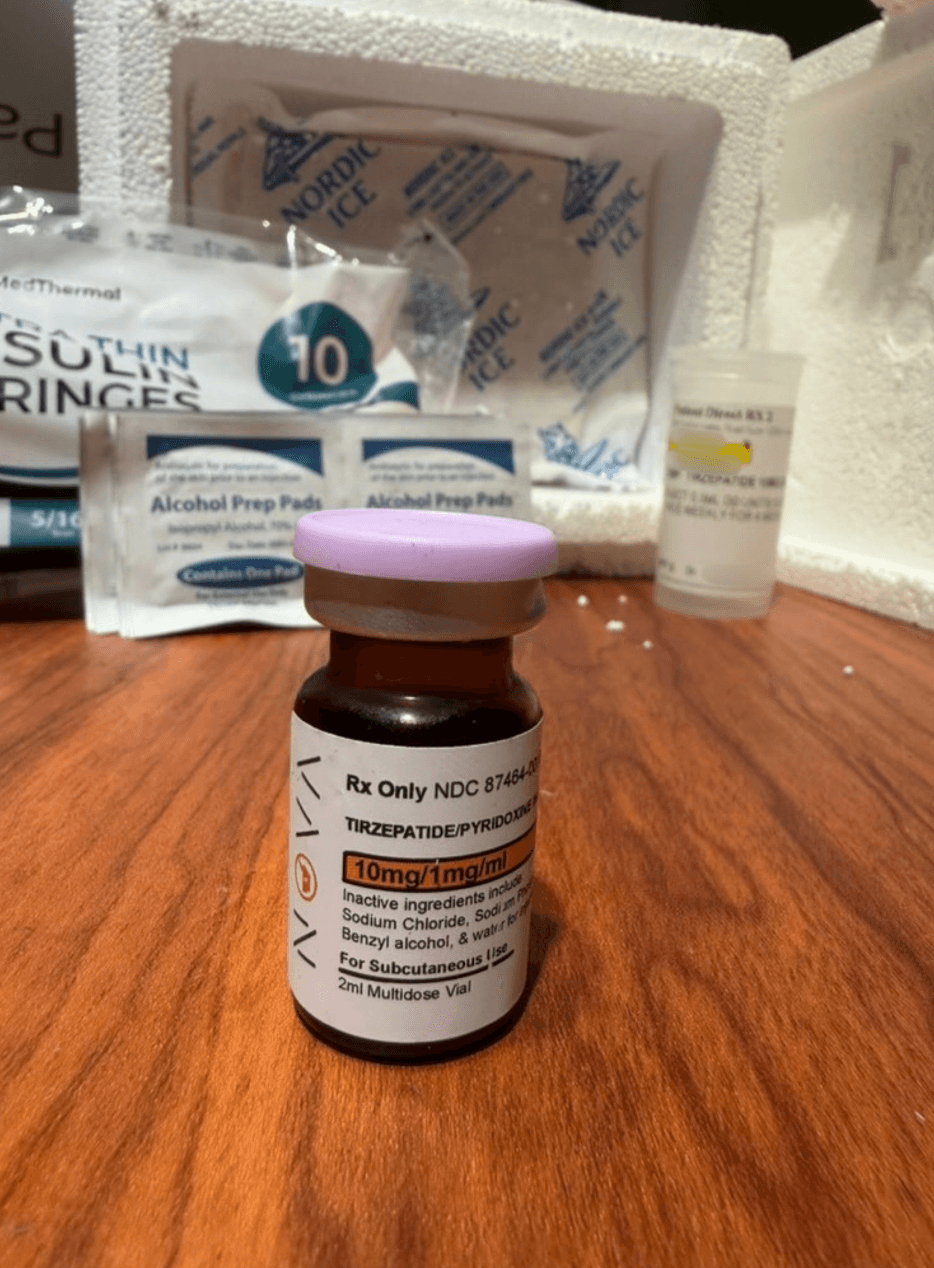 Amber compounded tirzepatide pyridoxine vial from Amble labeled 10 mg per 1 mg per mL, for subcutaneous use, 2 mL multidose vial