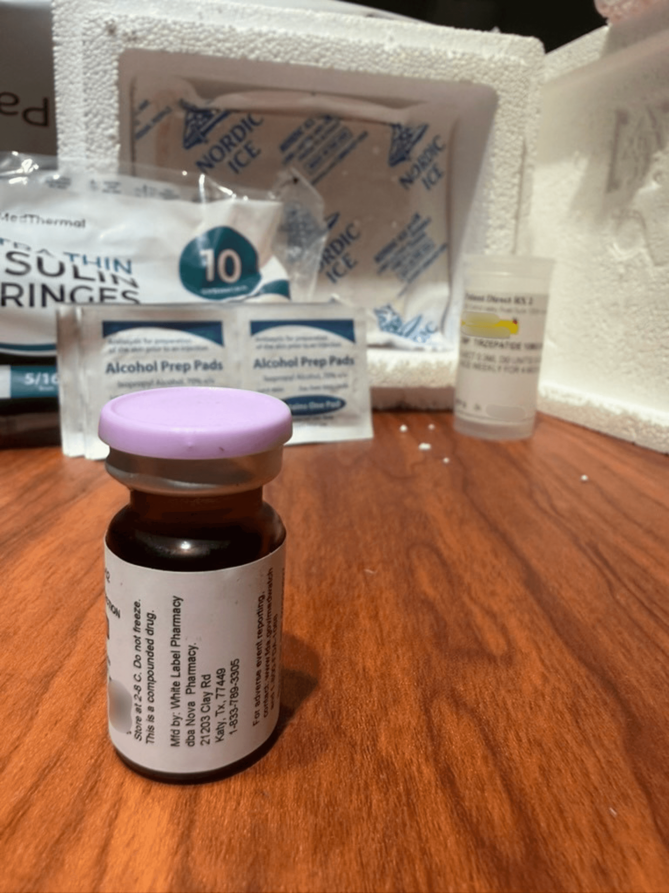 Back of the Amble vial label reading Mfd by White Label Pharmacy dba Nova Pharmacy, Katy, Texas, with storage and adverse event reporting text