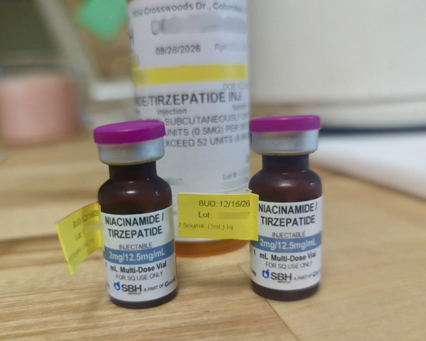 Two 1 mL Ivim Health vials labeled Niacinamide Tirzepatide 2 mg per 12.5 mg per mL from SBH Medical, with yellow BUD 12/16/26 flags