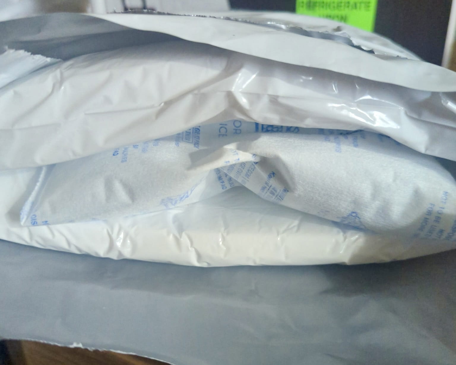 Opened Ivim Health insulated pouch showing two Nordic Ice gel packs in white sleeves between the padded layers