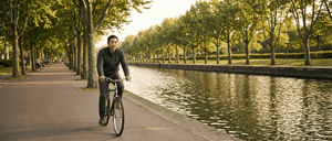 man-riding-bike-at-park.png