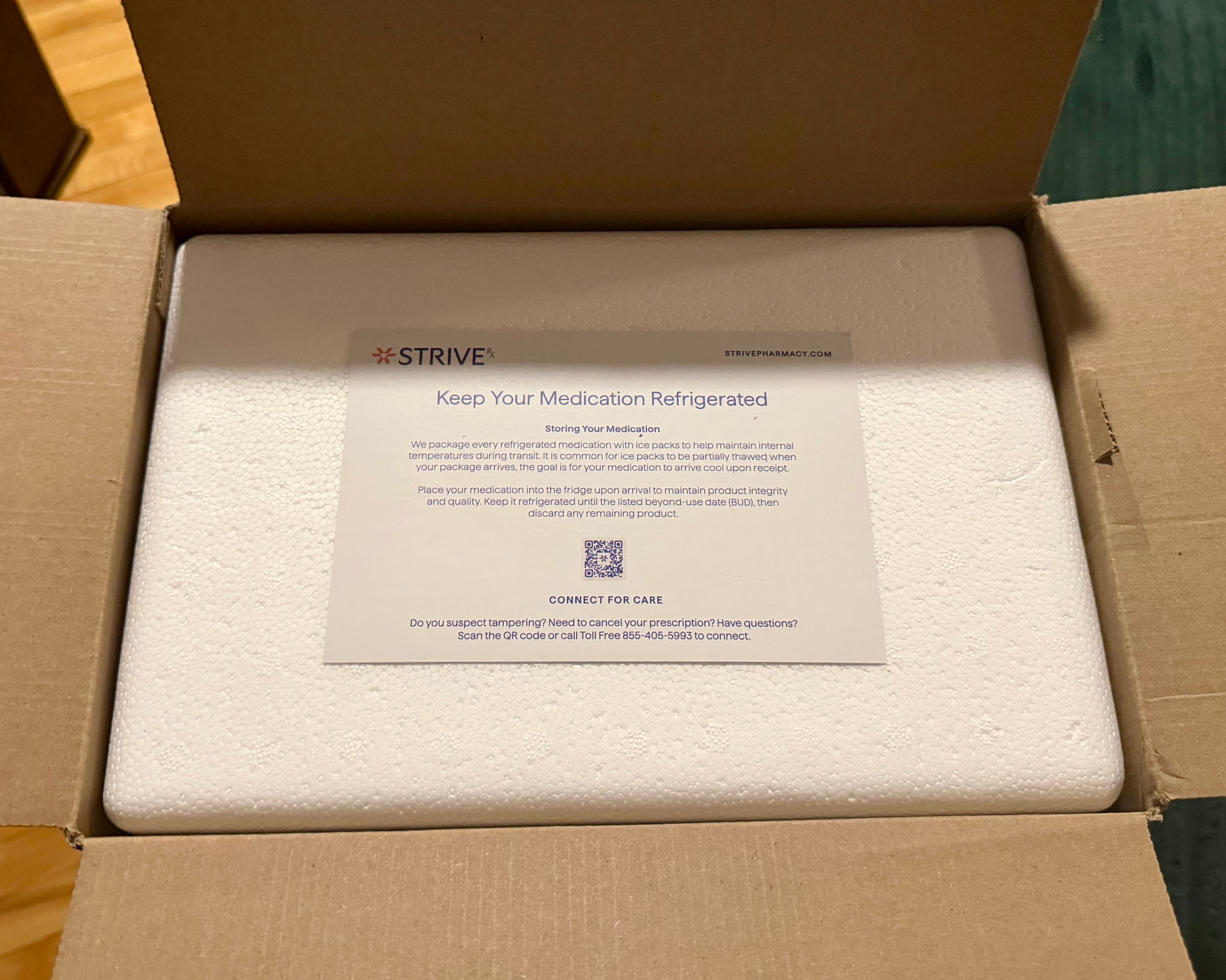 Open Strive Pharmacy shipping box showing a white styrofoam cooler with a Keep Your Medication Refrigerated card and QR code on top