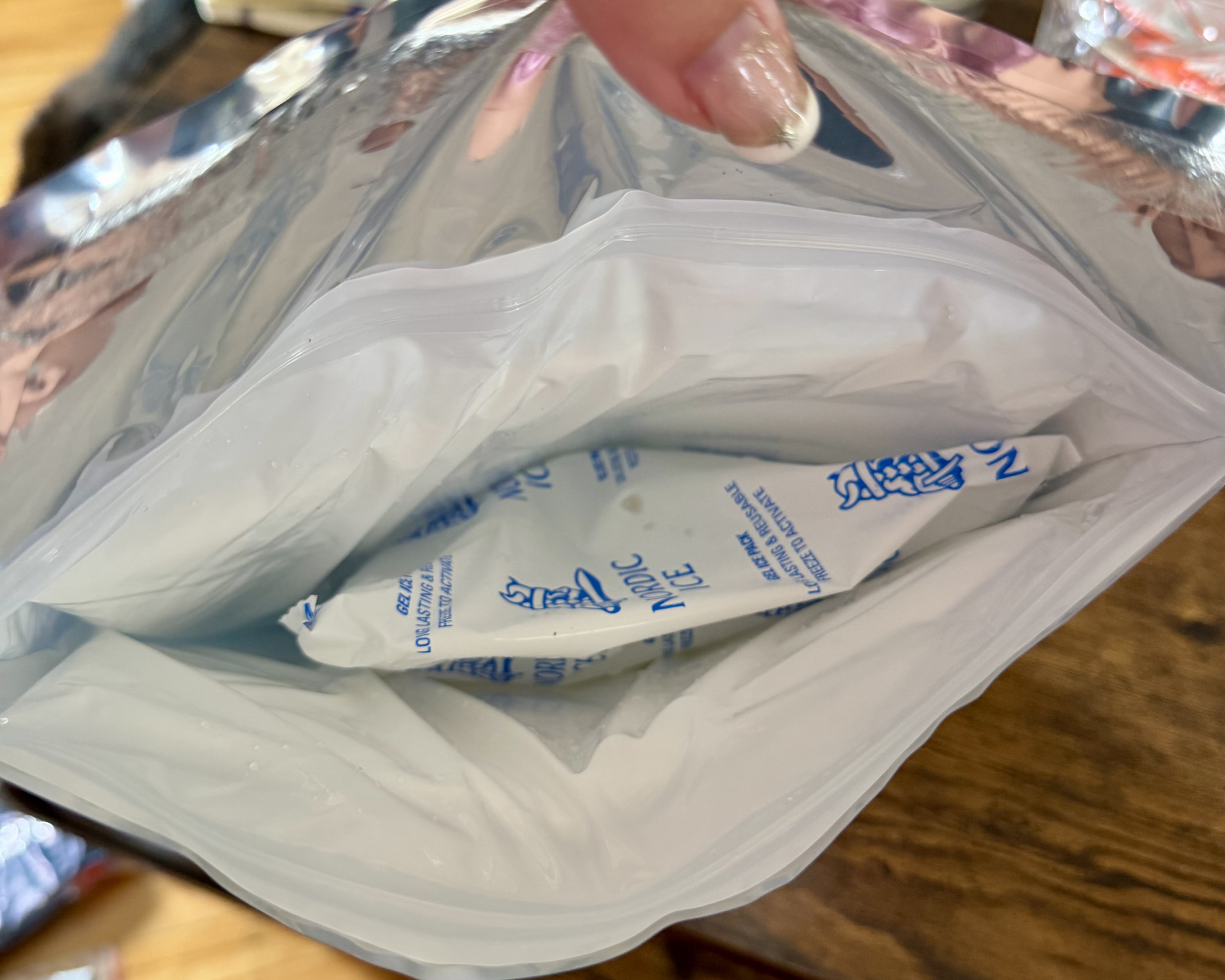 Two Nordic Ice gel packs inside the sealed mylar pouch from Shed, soft rather than frozen on arrival