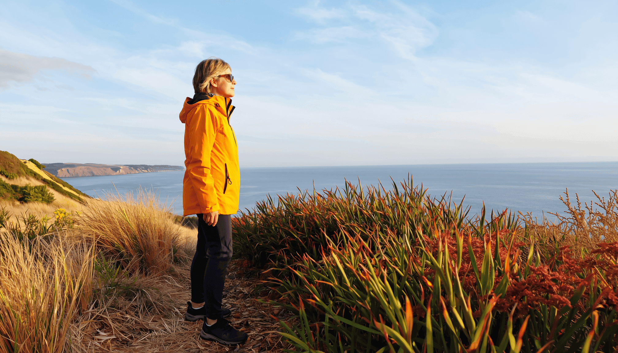 woman-looking-out-over-cliff